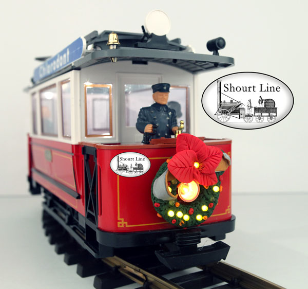 SL 8410118 Animated Holiday Wreath, 12 yellow LEDs for LGB Trolley power jacks on DC or DCC power front left side view