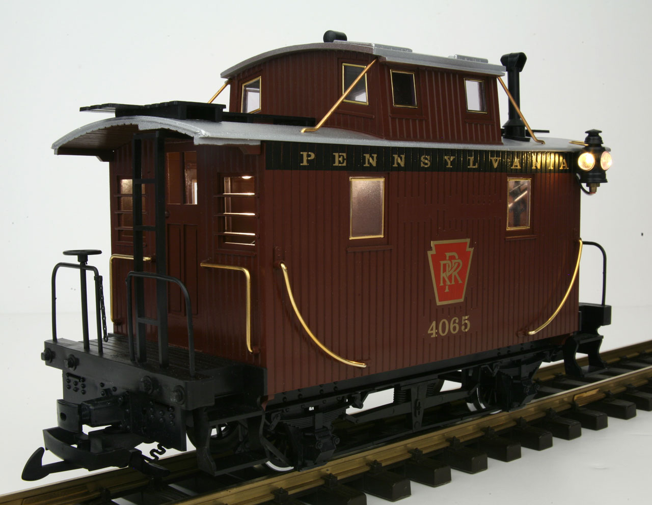 Pennsylvania Rail Road Caboose with Metal wheels, track powered interior and exterior lighting
